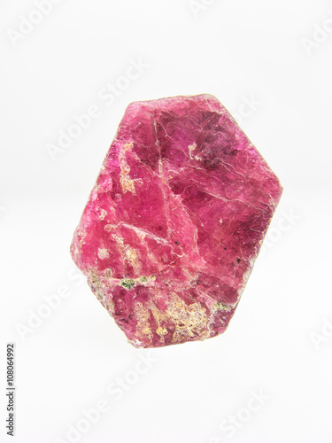 Natural  flat red Ruby corundum crystal showing the hexagonal shape on white. July Birthstone and used in alternative medicine as a powerful detoxifier photo