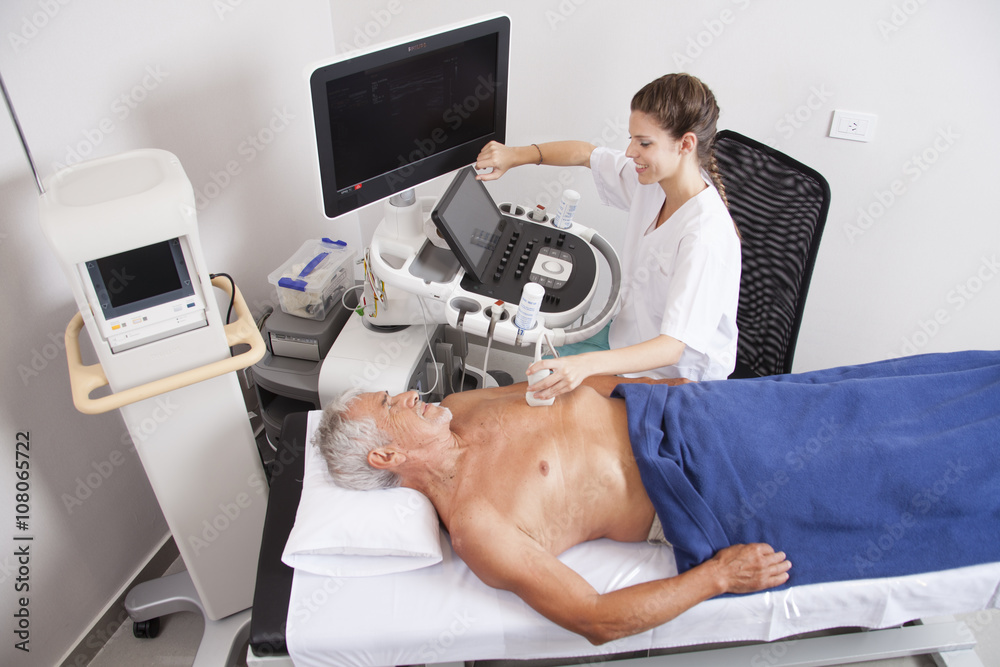 Woman doctor analyzing patient with ultrasound Woman doctor analyzing patient with ultrasound
