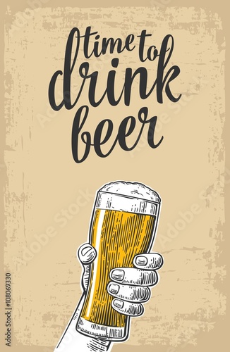 Male hand holding a beer glass. Vintage vector engraving illustration for web, poster, invitation to party - time to drink. Isolated on baige old paper texture  background