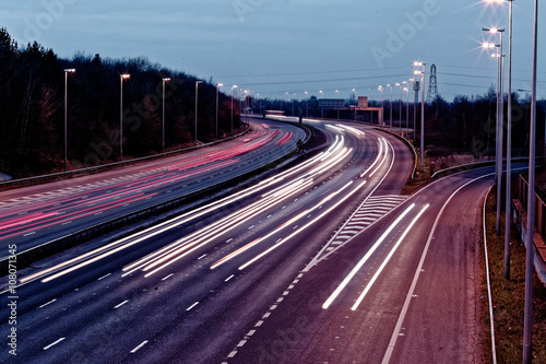 long exposure - motorway highway. long exposure - motorway highway. Night View of UK Motorway Highway. Busy traffic on a highway in early morning Car light trails on the highway Streaks of car lights