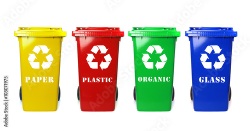 Four colorful recycle bins on white