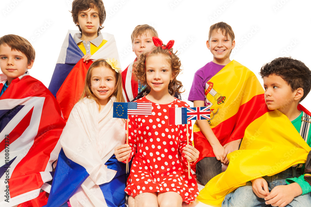 Children with flags wrapped in different banners Children with flags wrapped in different banners