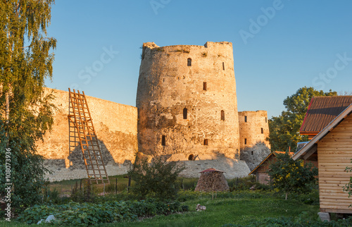 Old fortress. Tower Vyshka and Tower Ryabinovka of Izborsk fortress in the summer evening photo
