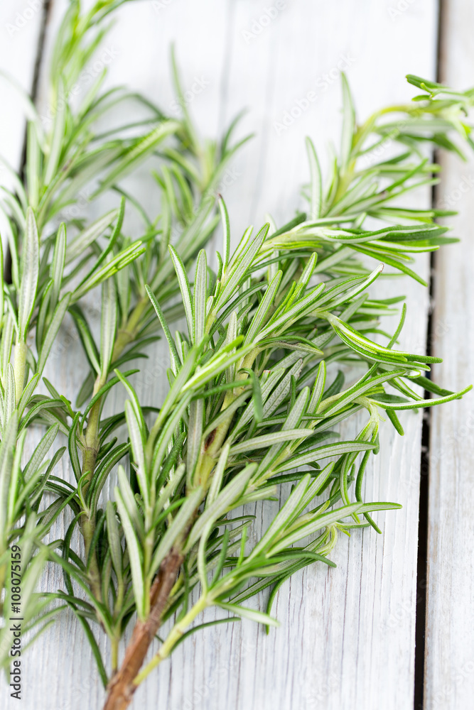 Obraz premium rosemary on wooden surface