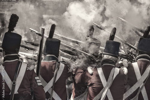 soldiers firing the guns re-enacting the war in 1812