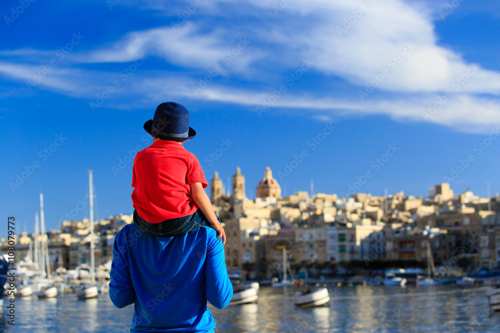 father and little son in the city of Valetta, Malta