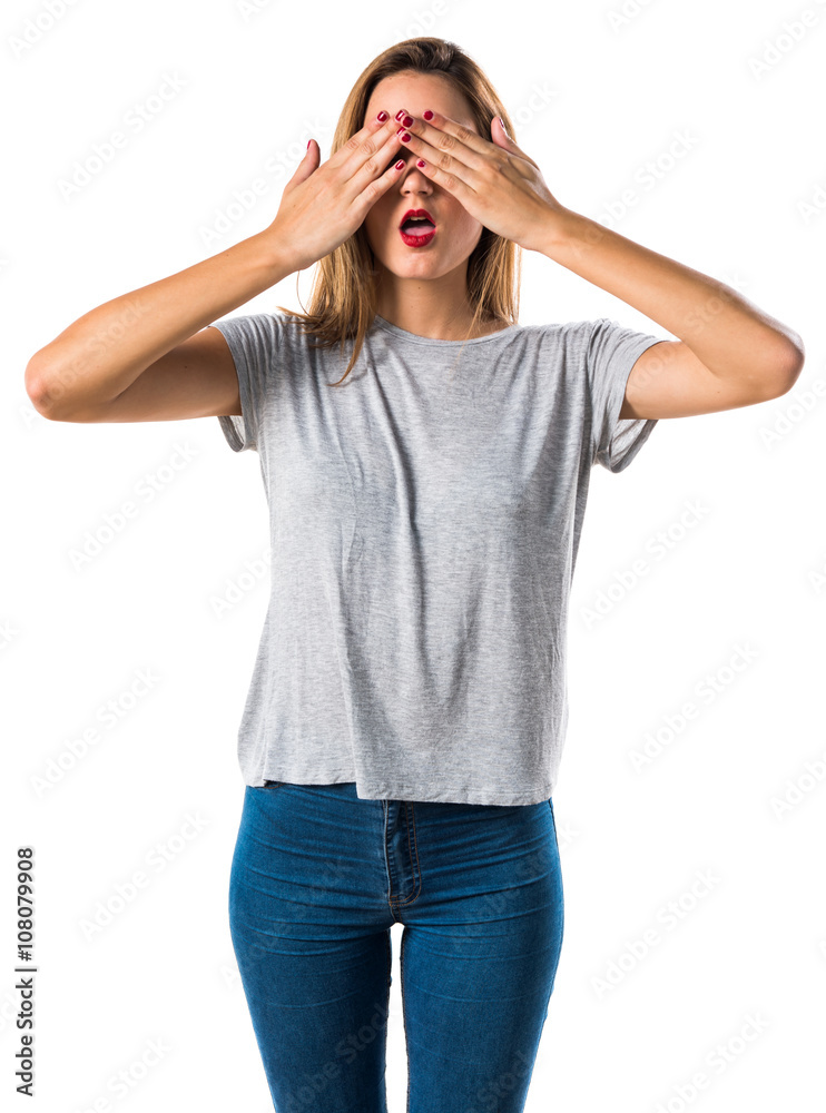 Young girl covering her eyes Young girl covering her eyes