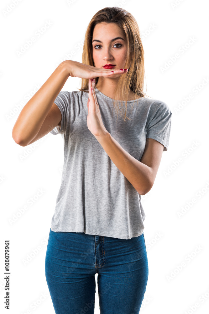 Young girl making time out gesture Young girl making time out gesture
