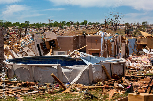 Propane Tanks Lined Up in front of debris from a destructive tornado