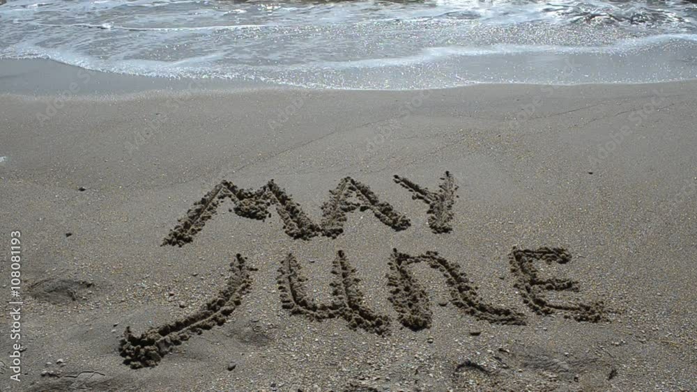 Inscription of the name of month on sand, the beach. Inscription of the name of month on sand, the beach.