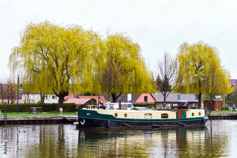 Little yacht sailing on Marne-Rhin canal in Saverne, France