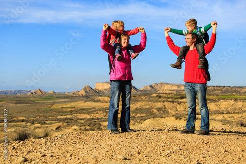 family with two kids travel in scenic mountains