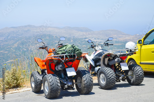 Two quad bikes in the parking lot in Greece