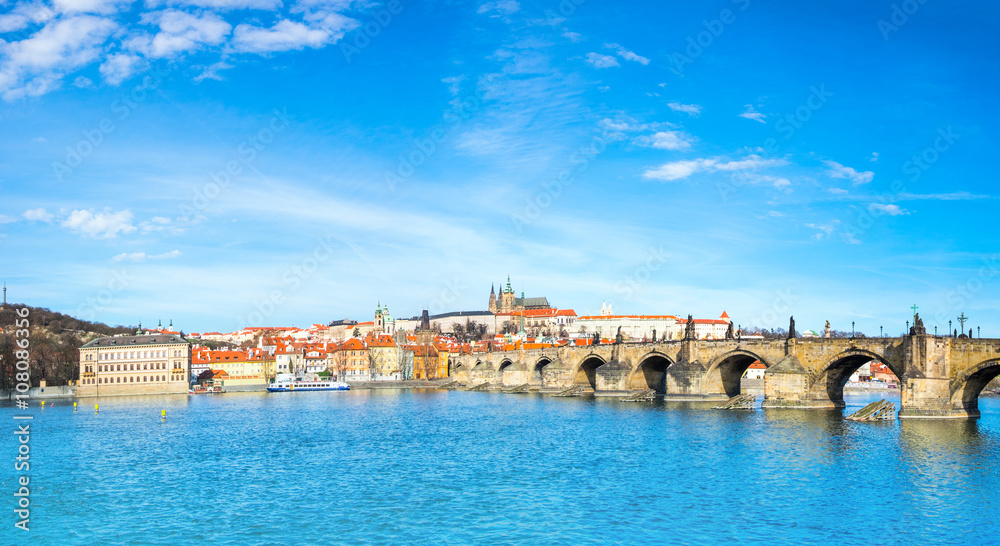 Charles Bridge and historical buildings in Prague from across th