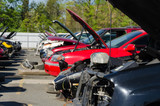 Different damaged cars on a junk yard