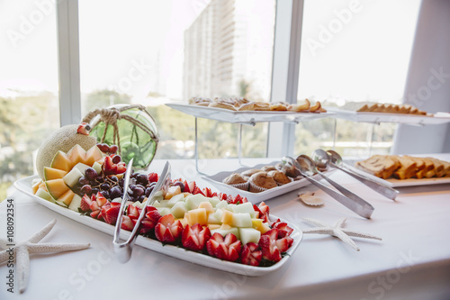 Close up of fruit and muffins at breakfast buffet