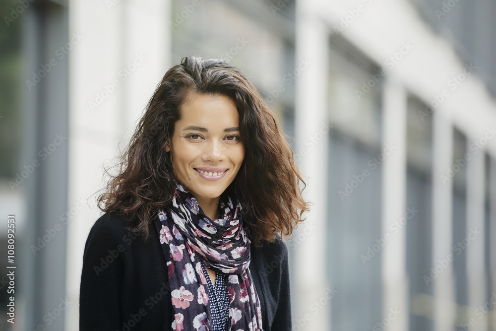 Mixed race woman smiling in city Mixed race woman smiling in city