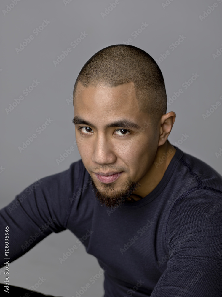Obraz premium young man with shaved head.