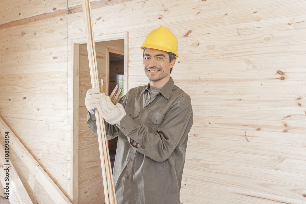 Carpenter working with house trim Carpenter working with house trim