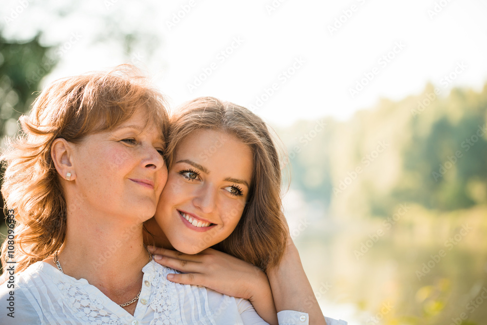 Happy together - mother and teenage daughter outdoor Happy together - mother and teenage daughter outdoor