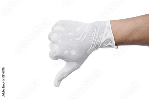 Hand wearing medical glove show thumb down