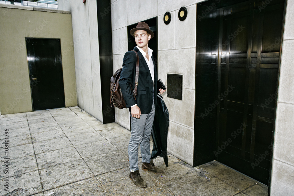 Caucasian businessman waiting for elevator Caucasian businessman waiting for elevator
