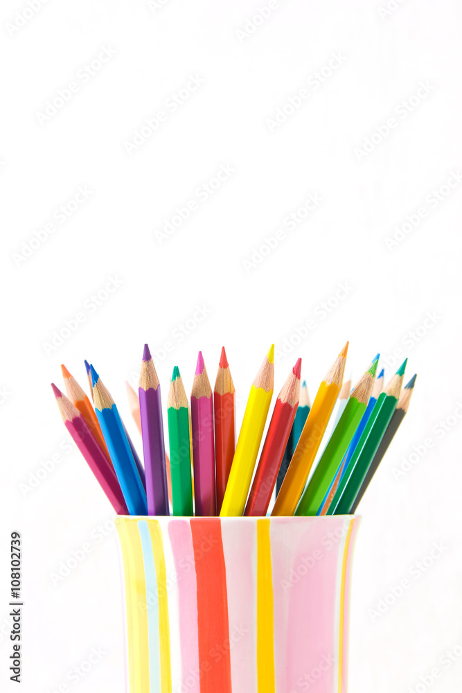 Group of color pencils in a colorful cup