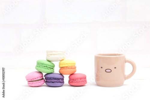 colorful macarons and little cup with vintage pastel filtered