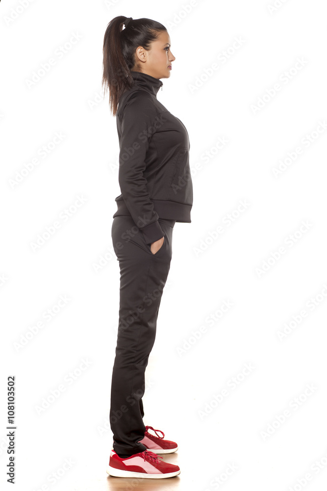 young pretty woman in tracksuits posing in the studio