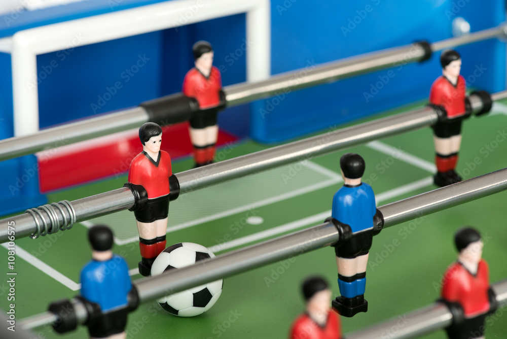 Fototapeta premium Close up of figures and ball in foosball table
