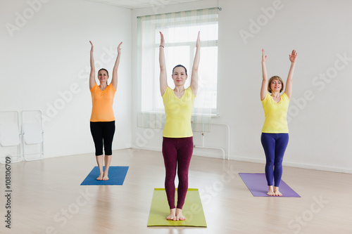 young women practicing yoga pose