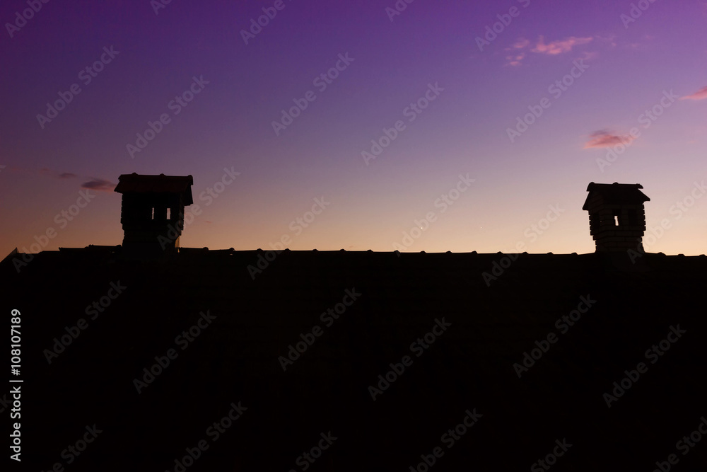 Fototapeta premium Silouhette of Chimney Like A Little House On The Roof