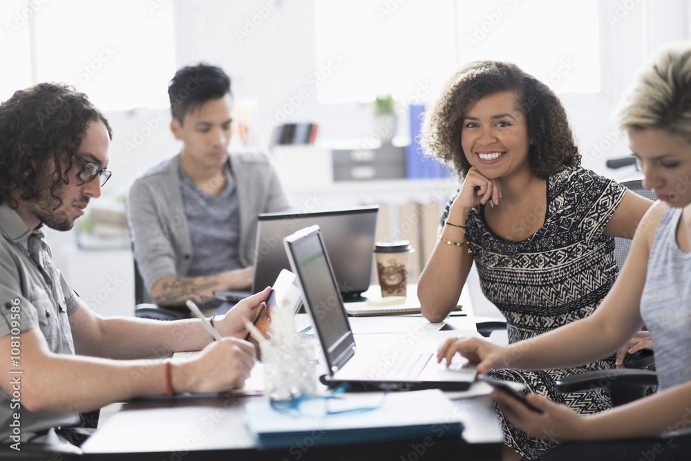 Businesswoman smiling in meeting Businesswoman smiling in meeting