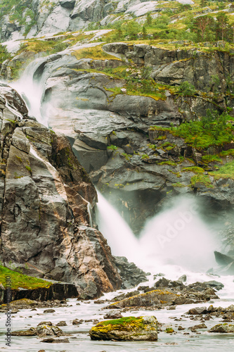 Beautiful Waterfall In The Valley Of Waterfalls In Norway. Hused photo