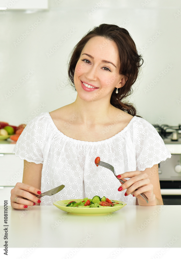 Woman making salad in kitchen. Healthy eating lifestyle concept. Woman making salad in kitchen. Healthy eating lifestyle concept.