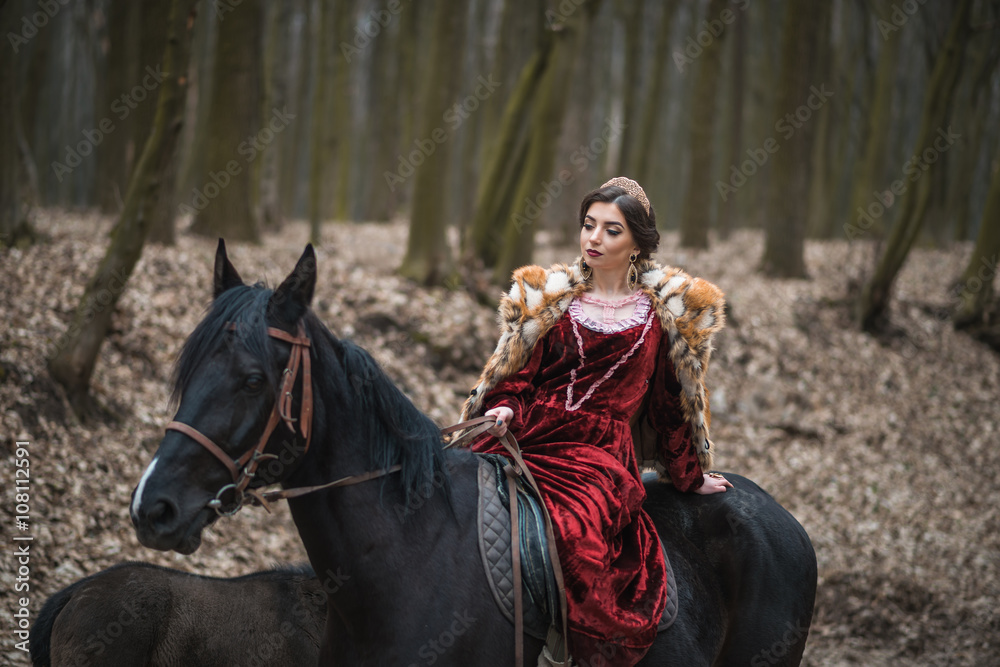 Fototapeta premium Princess with her horse in the woods