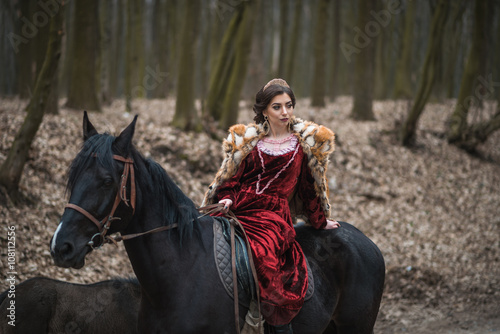 Princess with her horse in the woods © stelmaht