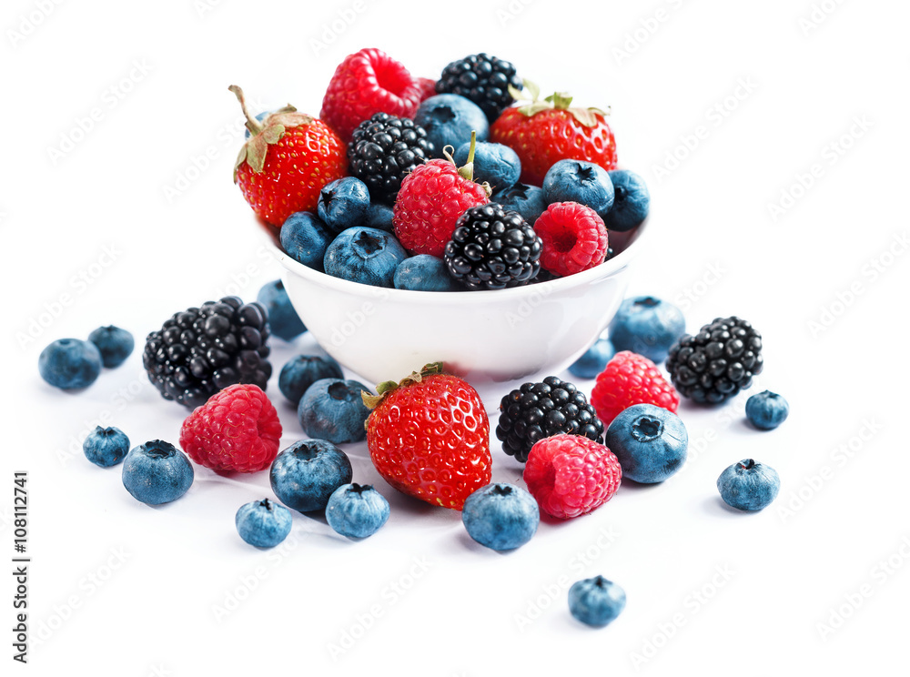 Ceramic bowl with assortment berries (blueberries, strawberries and blackberries) on white background. Close up, high resolution product. Harvest Concept Ceramic bowl with assortment berries (blueberries, strawberries and blackberries) on white background. Close up, high resolution product. Harvest Concept