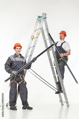 Two handymen at work stair