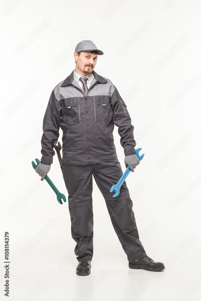 Worker in uniform with wrench Worker in uniform with wrench