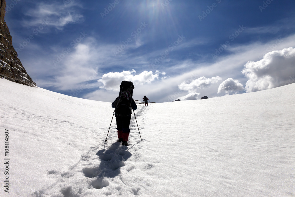 Two hikers on snow plateau