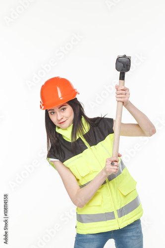 girl in a yellow vest with the tool