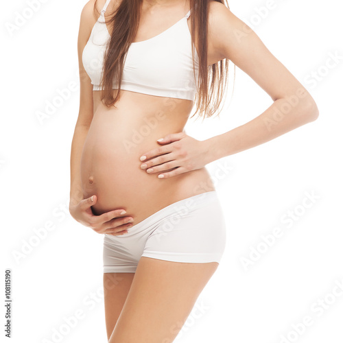 Happy beautiful pregnant woman against white background.