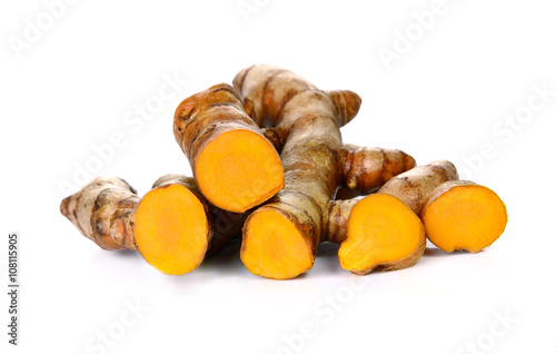 Turmeric roots on white background
