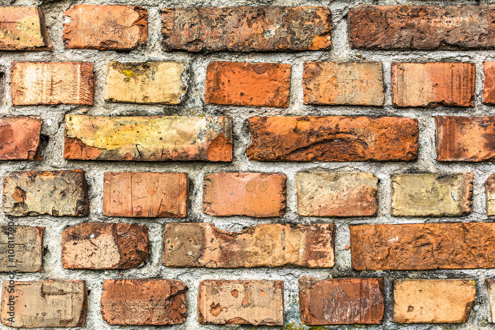 Obraz premium Old brick wall background, aged orange brick texture