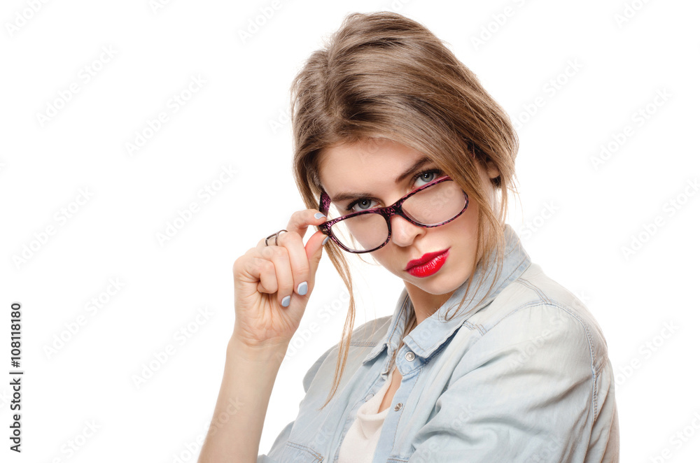 Woman in glasses on white background looking suspiciously