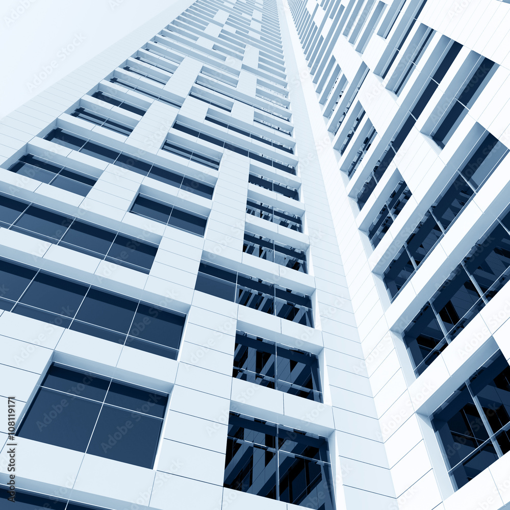 Tall building with shining windows in white walls