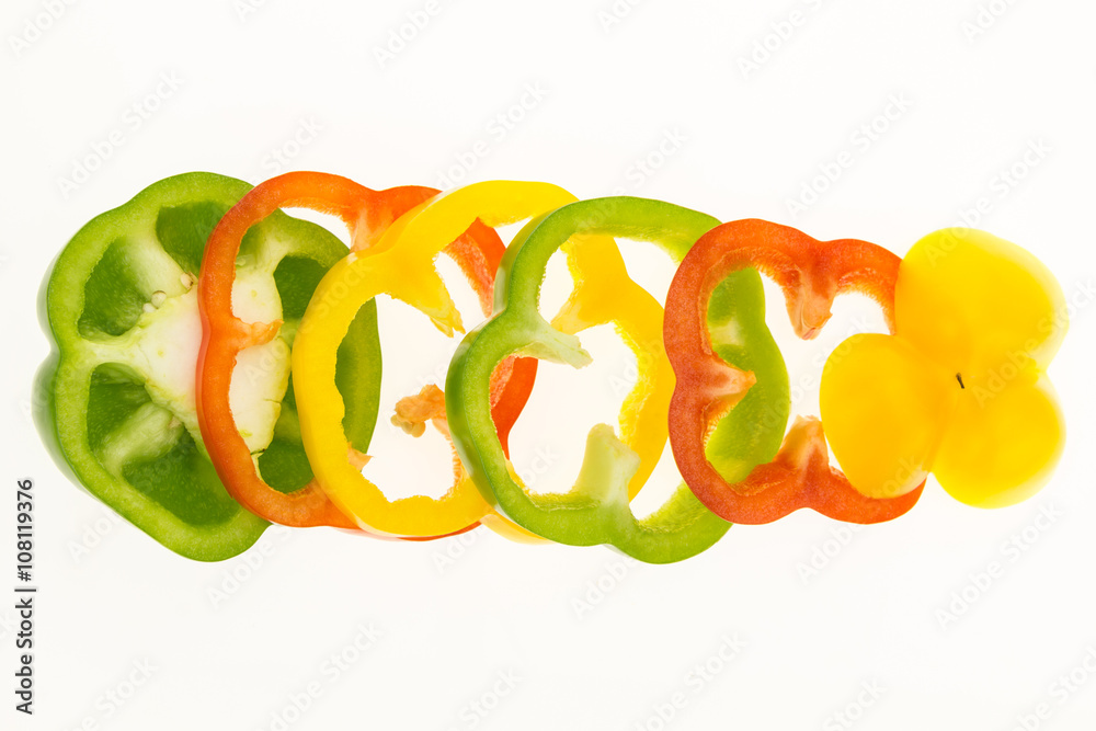 Fresh bell pepper sliced into rings, isolated on white background. Fresh bell pepper sliced into rings, isolated on white background.