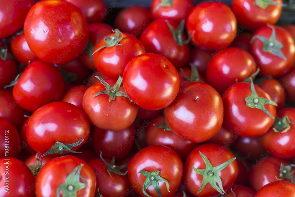 Bright red ripe tomatoes on market stall Bright red ripe tomatoes on market stall
