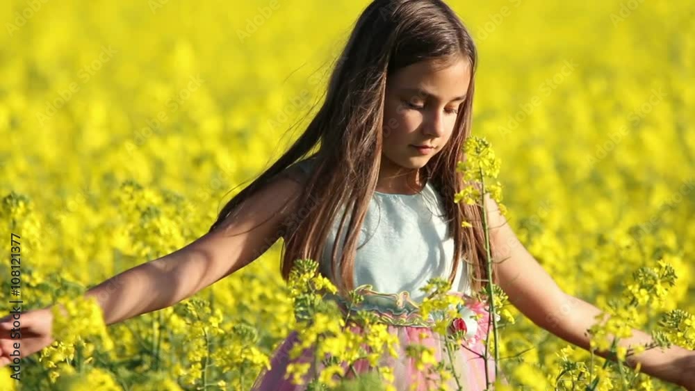 Happy Beauty young girl playing in yellow rape field in rural countryside. Portrait shot, Happy Freedom outdoors concept. Happy Beauty young girl playing in yellow rape field in rural countryside. Portrait shot, Happy Freedom outdoors concept.